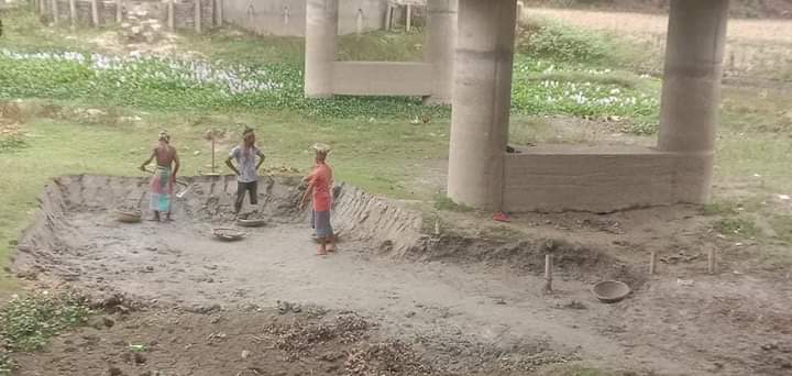 নির্মাণাধীন সেতুর নিচে মাটি কাটার ধুম